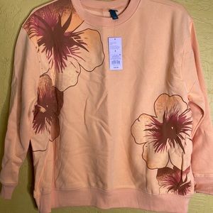 Sweater peach color with flower design